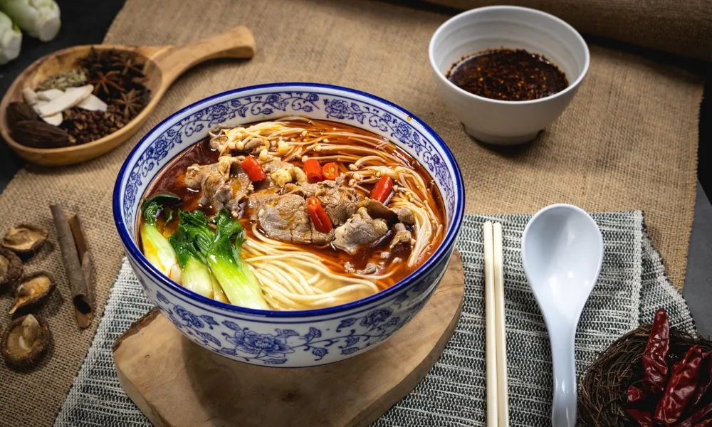 Spicy beef noodle with enoki mushroom at Northern Cafe, a Chinese Restaurant in Huntington Beach